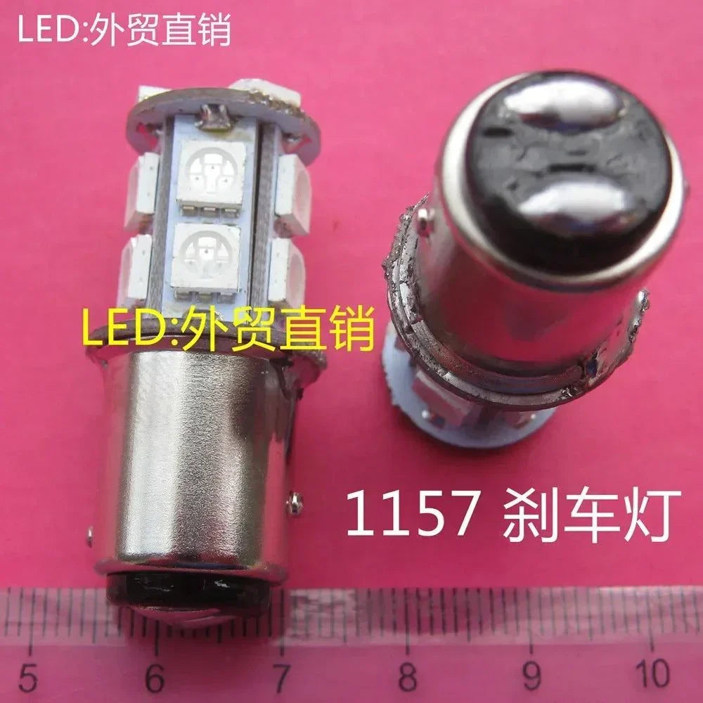 24V LED BAY15D 1157 bayonet base brake light bulb with multiple SMD LEDs on pink background