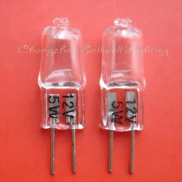Set of two 12v 5w G4 halogen bulbs with metal pins on red background